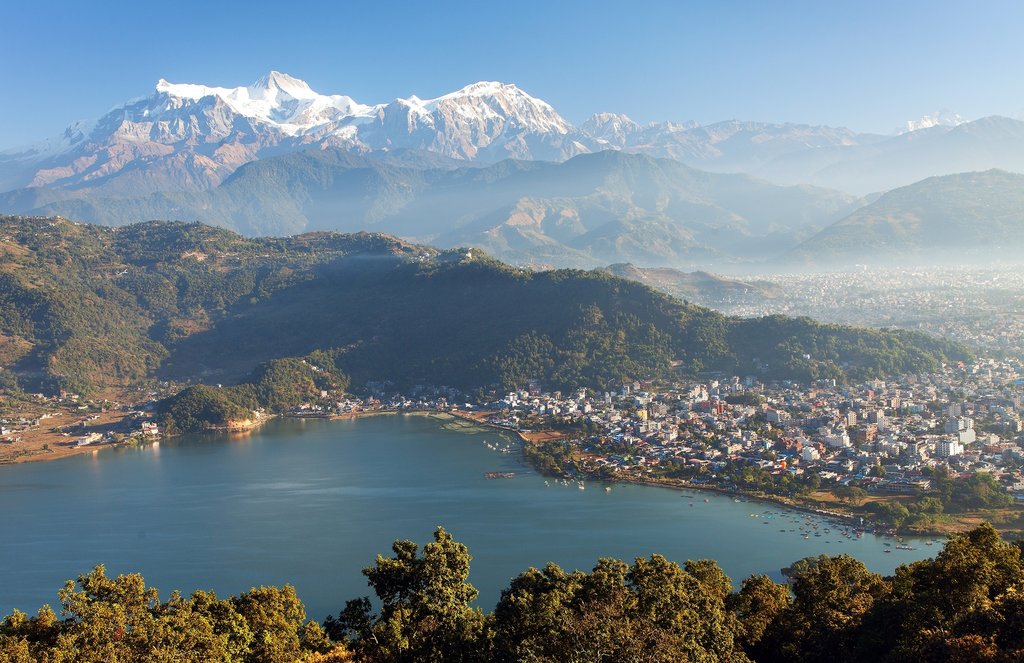 Pokhara is a beautiful city in Nepal, known for its lakes, mountains, and natural beauty. It lies about 200 km west of Kathmandu and is a popular tourist destination. The city is famous for Phewa Lake, the stunning view of the Annapurna mountain range, and adventure activities like paragliding, boating, and trekking. Pokhara is also the gateway to the Annapurna Base Camp trek. The peaceful environment and scenic landscapes make it one of the most loved places in Nepal.